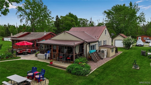 12383 Lake Forest Ln Unit 42, Yates, NY 14098 - back of house featuring an outdoor hangout area, a sunroom, metal roof, and a yard
