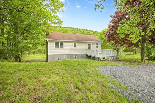 10610 State Route 7, Worcester, NY 12149 - back of house featuring a deck, a chimney, and a lawn