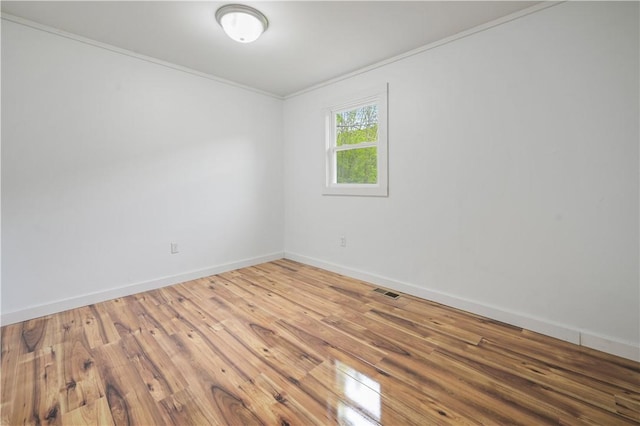 10610 State Route 7, Worcester, NY 12149 - spare room featuring hardwood / wood-style floors, baseboards, and crown molding