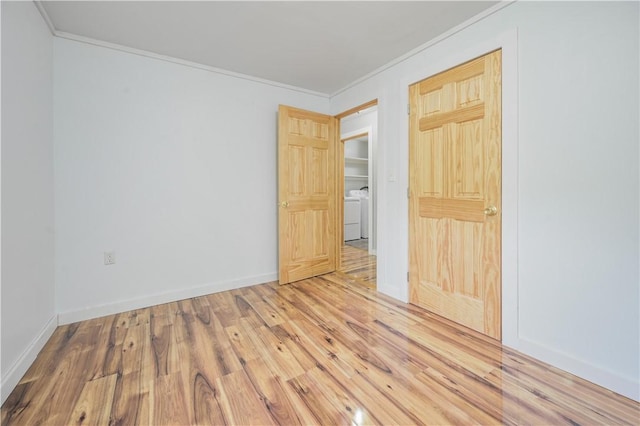 10610 State Route 7, Worcester, NY 12149 - unfurnished bedroom featuring crown molding, wood finished floors, washer / dryer, and baseboards