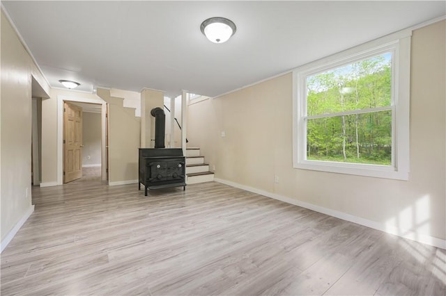 10610 State Route 7, Worcester, NY 12149 - unfurnished living room featuring light wood-style floors, stairway, and baseboards