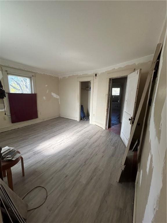 1227 Lake St, Elmira-City, NY 14901 - unfurnished living room with light wood-style flooring and baseboards