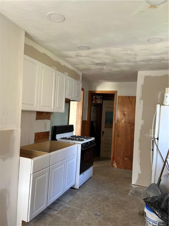 1227 Lake St, Elmira-City, NY 14901 - kitchen with white appliances and white cabinets