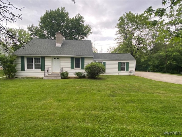 5780 Sheridan Dr, Amherst, NY 14221 - view of front of home featuring a chimney and a front lawn