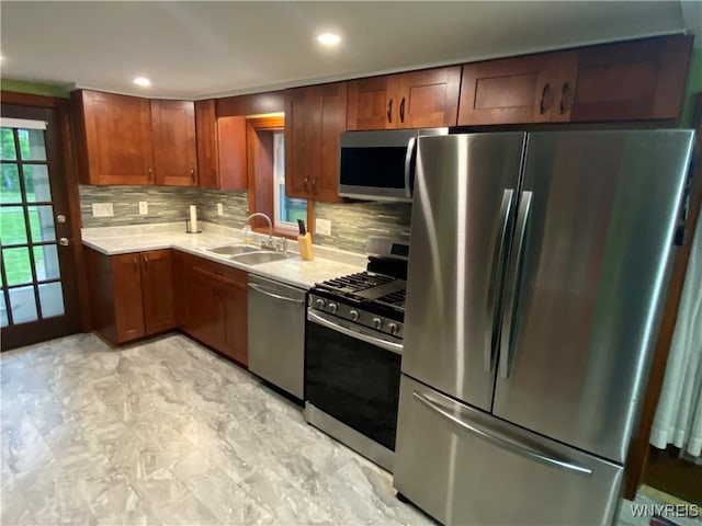 5780 Sheridan Dr, Amherst, NY 14221 - kitchen featuring appliances with stainless steel finishes, a sink, light countertops, backsplash, and recessed lighting