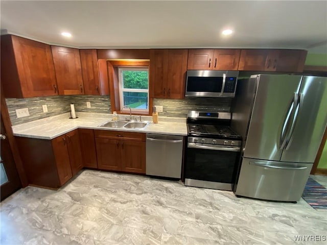 5780 Sheridan Dr, Amherst, NY 14221 - kitchen featuring appliances with stainless steel finishes, a sink, light countertops, tasteful backsplash, and recessed lighting