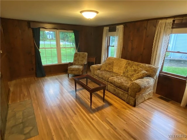 5780 Sheridan Dr, Amherst, NY 14221 - living room featuring wood finished floors and wood walls