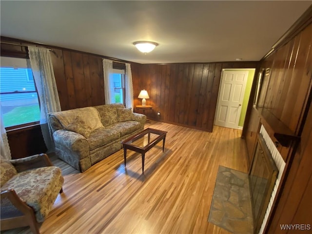 5780 Sheridan Dr, Amherst, NY 14221 - living room with light wood-style floors and wooden walls