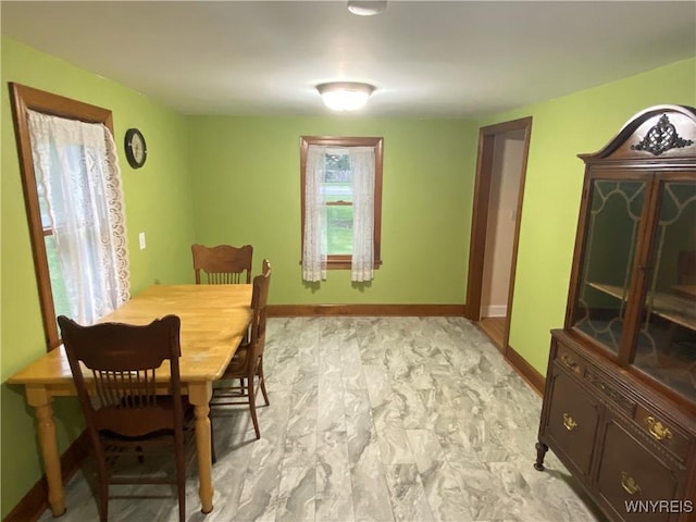 5780 Sheridan Dr, Amherst, NY 14221 - dining room with baseboards and light marble finish floors