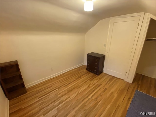 5780 Sheridan Dr, Amherst, NY 14221 - bonus room with wood finished floors, vaulted ceiling, and baseboards