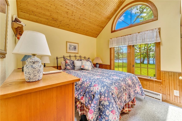 2555 County Highway 22, Richfield, NY 13439 - bedroom with a baseboard heating unit, multiple windows, wainscoting, wooden walls, and wooden ceiling