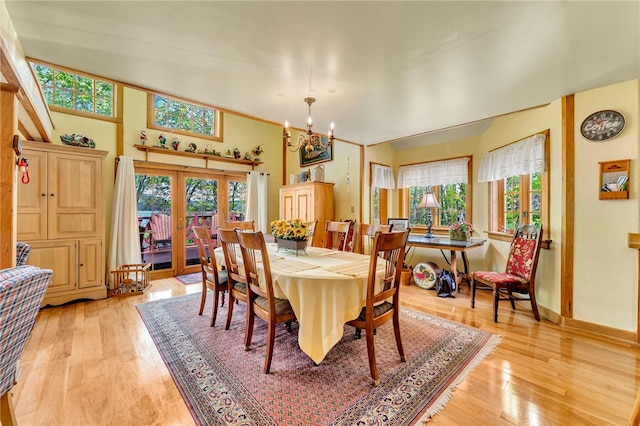 2555 County Highway 22, Richfield, NY 13439 - dining space featuring french doors, light wood-type flooring, baseboards, and a chandelier