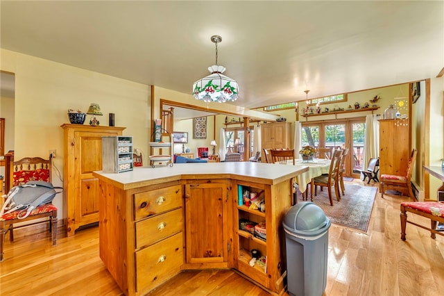 2555 County Highway 22, Richfield, NY 13439 - kitchen featuring light countertops, light wood-type flooring, hanging light fixtures, and a baseboard heating unit