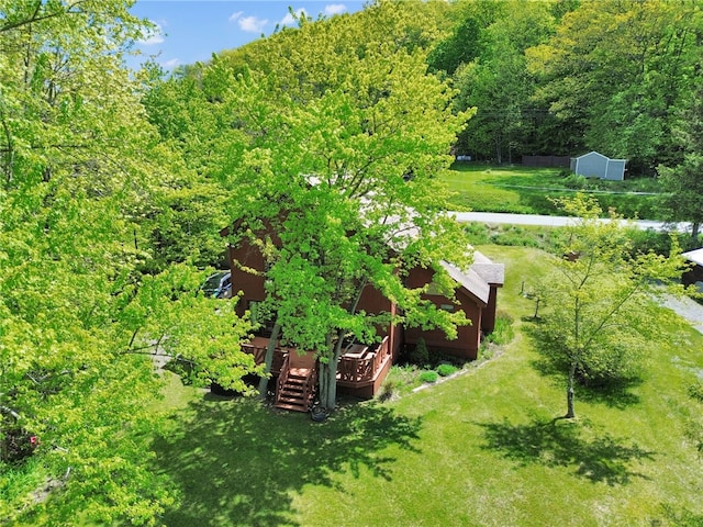 2555 County Highway 22, Richfield, NY 13439 - view of green lawn with a wooden deck and a wooded view
