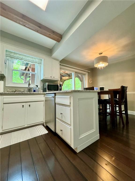 7 Overbrook Dr, Owego, NY 13732 - kitchen with dark wood-type flooring, stainless steel appliances, a peninsula, white cabinets, and beam ceiling
