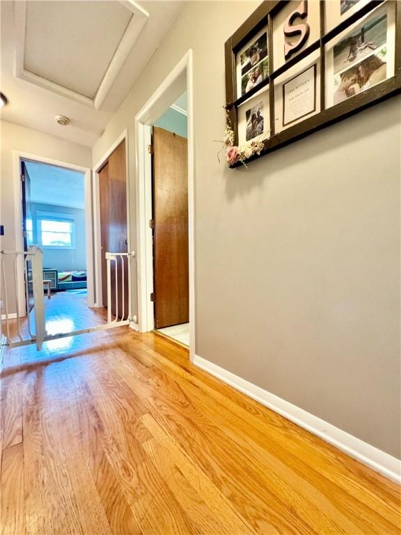 7 Overbrook Dr, Owego, NY 13732 - corridor with attic access, wood finished floors, and baseboards