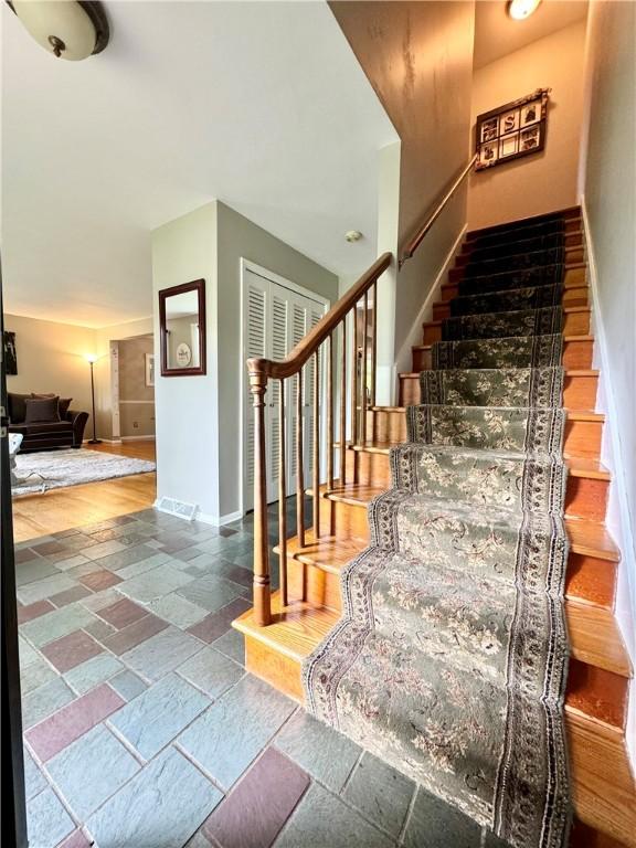 7 Overbrook Dr, Owego, NY 13732 - stairs with baseboards and stone finish flooring