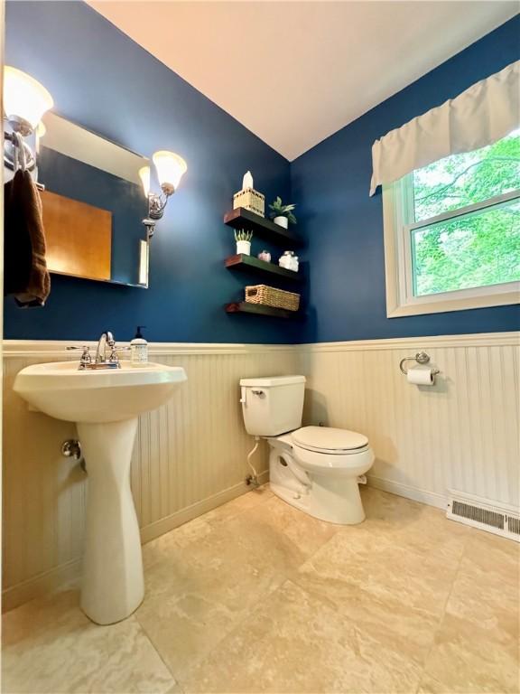 7 Overbrook Dr, Owego, NY 13732 - half bath with wainscoting, toilet, and lofted ceiling
