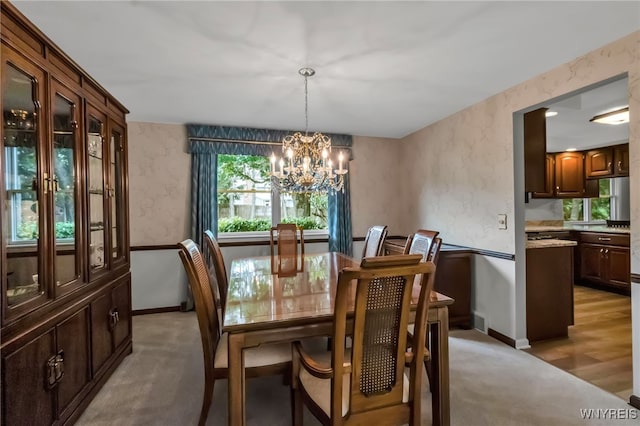 4640 Pine Mnr Unit W, Clarence, NY 14031 - dining room with a chandelier, light carpet, baseboards, and wallpapered walls