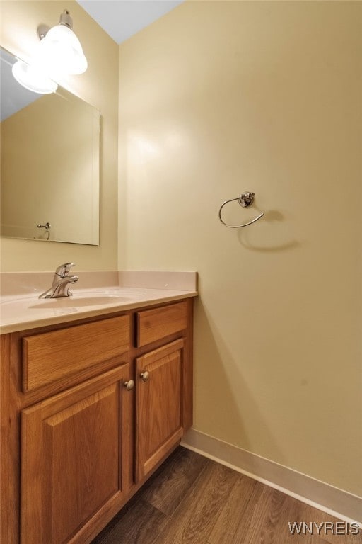 4640 Pine Mnr Unit W, Clarence, NY 14031 - bathroom with vanity, wood finished floors, and baseboards