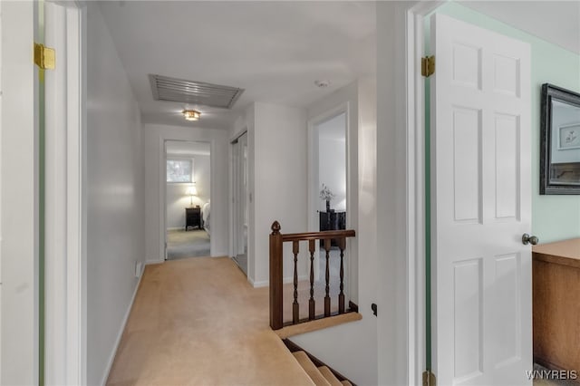 4640 Pine Mnr Unit W, Clarence, NY 14031 - hall with an upstairs landing, light carpet, baseboards, and attic access
