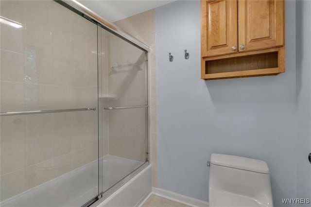 4640 Pine Mnr Unit W, Clarence, NY 14031 - bathroom featuring toilet, shower / bath combination with glass door, and baseboards