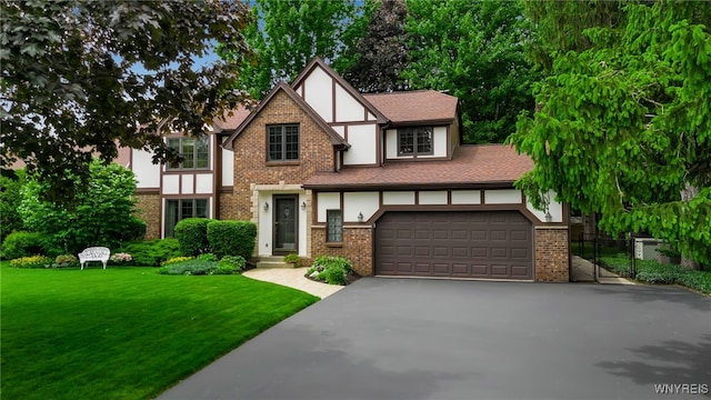 4640 Pine Mnr Unit W, Clarence, NY 14031 - tudor home with driveway, stucco siding, and brick siding