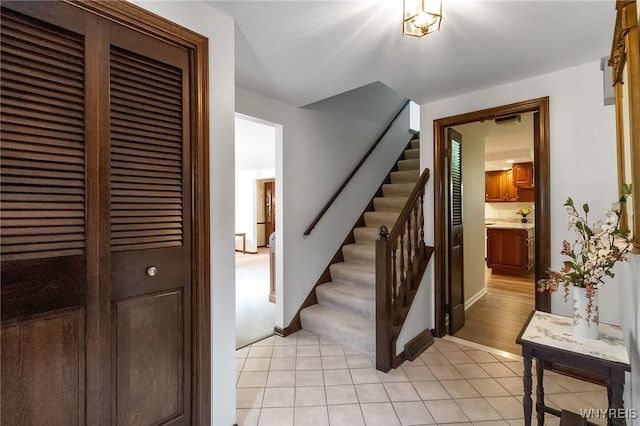 4640 Pine Mnr Unit W, Clarence, NY 14031 - stairway with tile patterned floors and baseboards