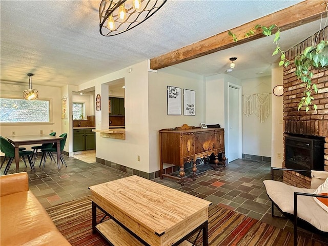 25 Woodside Ave, Oneonta-City, NY 13820 - living area with stone tile floors, a textured ceiling, baseboards, and a fireplace