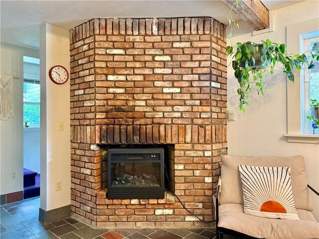 25 Woodside Ave, Oneonta-City, NY 13820 - detailed view of a fireplace and baseboards