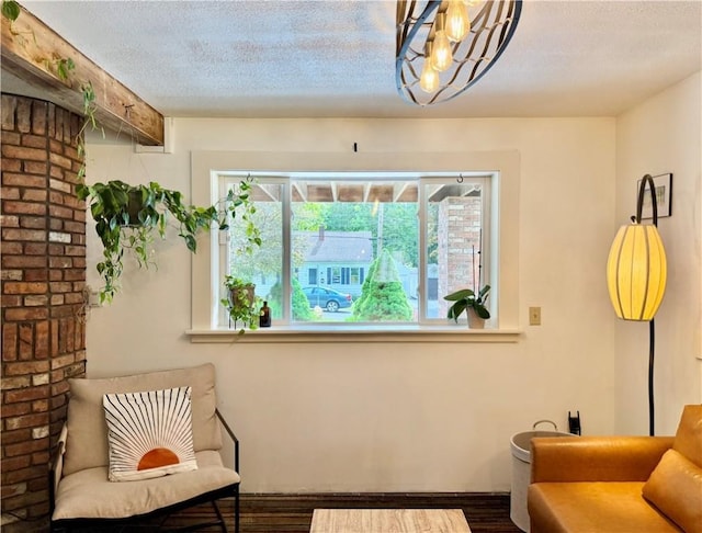 25 Woodside Ave, Oneonta-City, NY 13820 - sitting room with wood finished floors and a textured ceiling