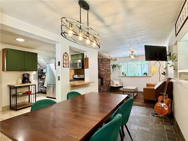 25 Woodside Ave, Oneonta-City, NY 13820 - dining space with a textured ceiling, stone finish floors, and a brick fireplace