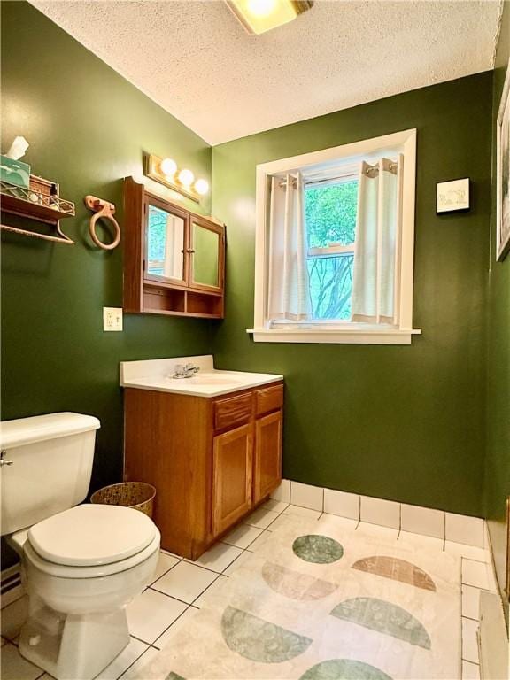25 Woodside Ave, Oneonta-City, NY 13820 - bathroom featuring toilet, vanity, a textured ceiling, and tile patterned flooring