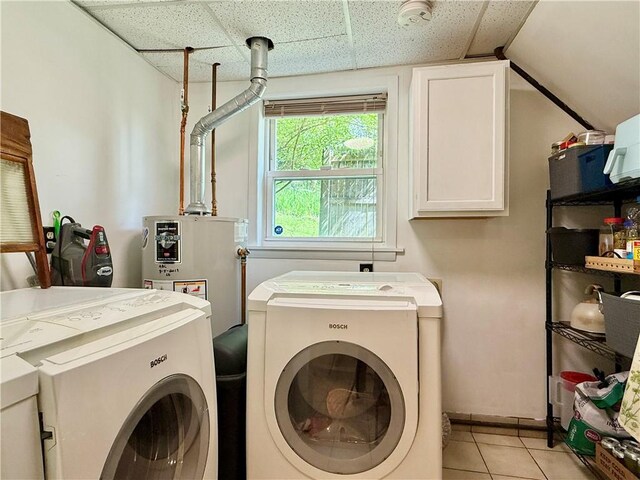 25 Woodside Ave, Oneonta-City, NY 13820 - washroom with washing machine and dryer, cabinet space, water heater, and light tile patterned floors