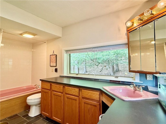 25 Woodside Ave, Oneonta-City, NY 13820 - kitchen with a sink, brown cabinets, and dark countertops
