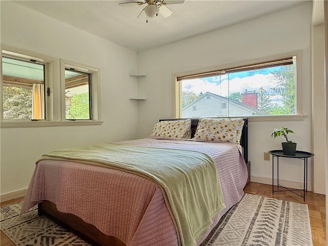 25 Woodside Ave, Oneonta-City, NY 13820 - bedroom with multiple windows, baseboards, wood finished floors, and a ceiling fan