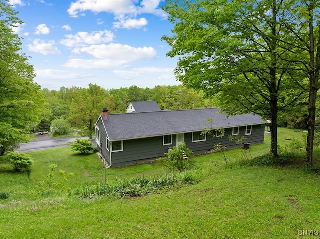 11245 Bell Hill Rd, Deerfield, NY 13502 - back of property featuring a yard, a chimney, and a forest view
