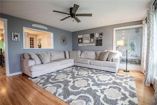 11245 Bell Hill Rd, Deerfield, NY 13502 - living room featuring wood finished floors, baseboards, and ceiling fan