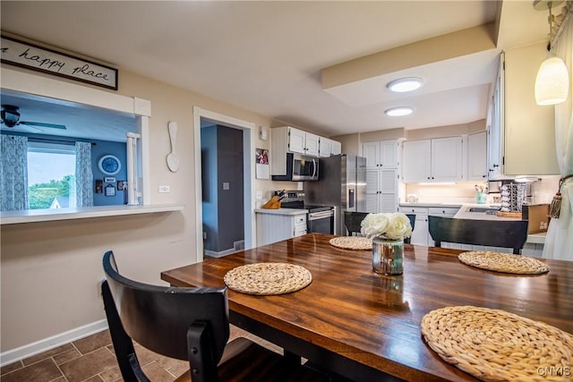 11245 Bell Hill Rd, Deerfield, NY 13502 - dining space with baseboards and a ceiling fan