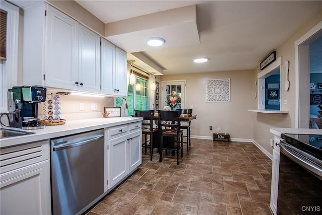 11245 Bell Hill Rd, Deerfield, NY 13502 - kitchen with appliances with stainless steel finishes, stone finish floors, white cabinets, baseboards, and light countertops