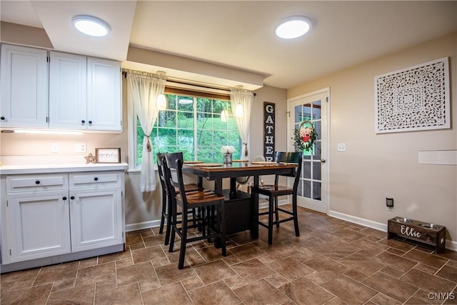 11245 Bell Hill Rd, Deerfield, NY 13502 - dining room with baseboards and stone finish floors