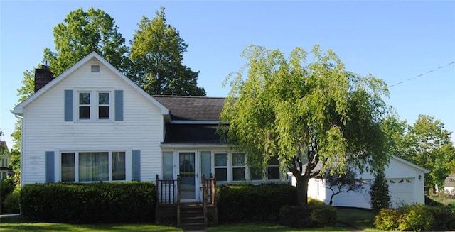202 Birch St, Kane-Borough, PA 16735 - traditional-style home with an attached garage, a chimney, a front lawn, and a shingled roof