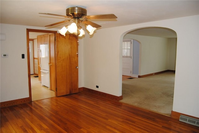 202 Birch St, Kane-Borough, PA 16735 - unfurnished room with arched walkways, a ceiling fan, and baseboards