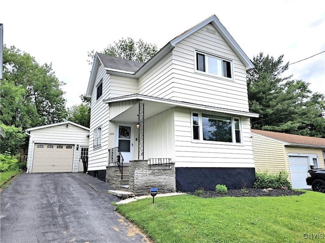 309 Helen St, Syracuse, NY 13203 - view of front facade featuring an outbuilding, a front lawn, driveway, and a garage