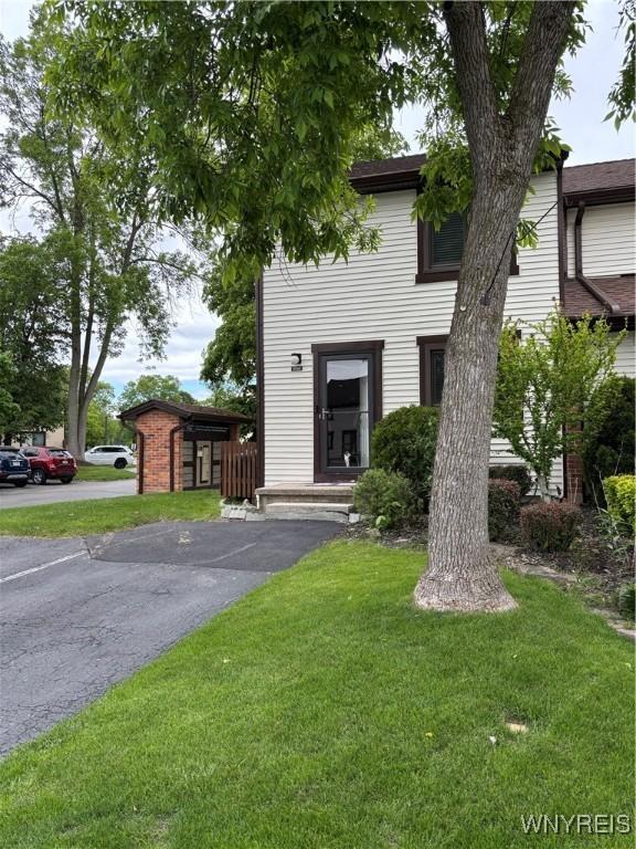 1056 Charlesgate Cir, Amherst, NY 14051 - view of front of house with a front lawn
