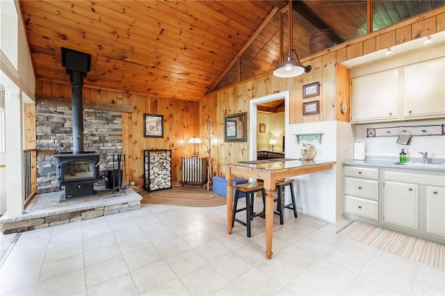 4255 Parish Hill Rd, Italy, NY 14512 - kitchen with wood walls, vaulted ceiling, a sink, wooden ceiling, and white cabinetry