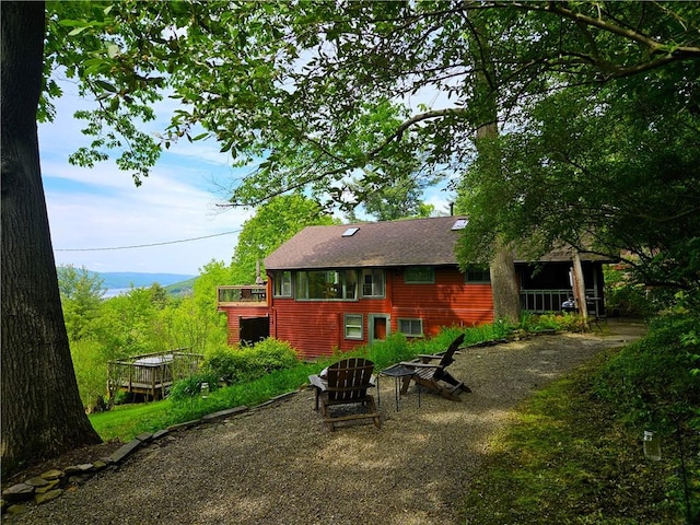 4255 Parish Hill Rd, Italy, NY 14512 - rear view of house featuring a shingled roof and a deck