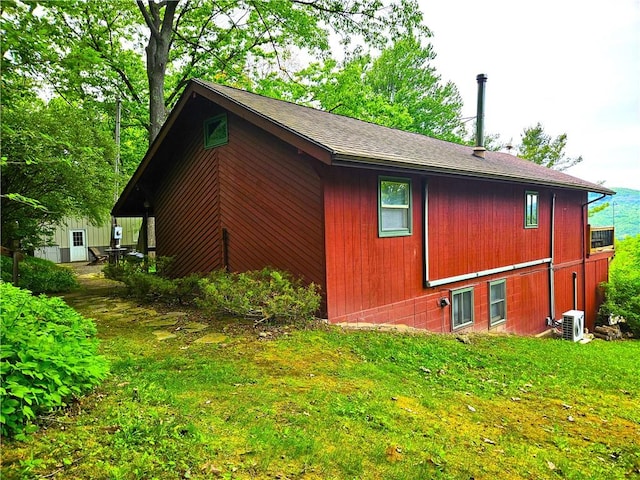 4255 Parish Hill Rd, Italy, NY 14512 - view of side of property with a lawn, roof with shingles, and a cooling unit
