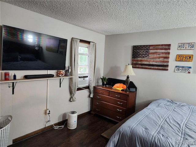 237 Tremont St, North Tonawanda, NY 14120 - bedroom with dark wood finished floors, a textured ceiling, and baseboards
