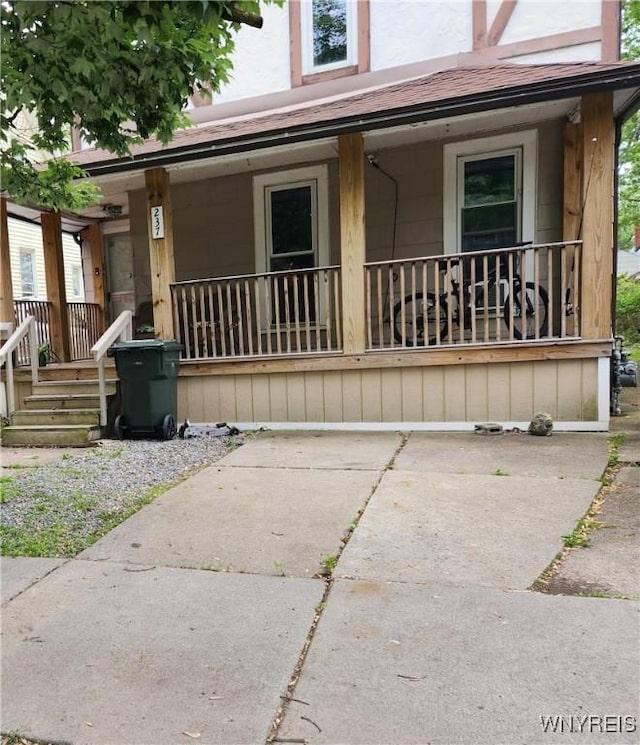 237 Tremont St, North Tonawanda, NY 14120 - view of front facade featuring covered porch